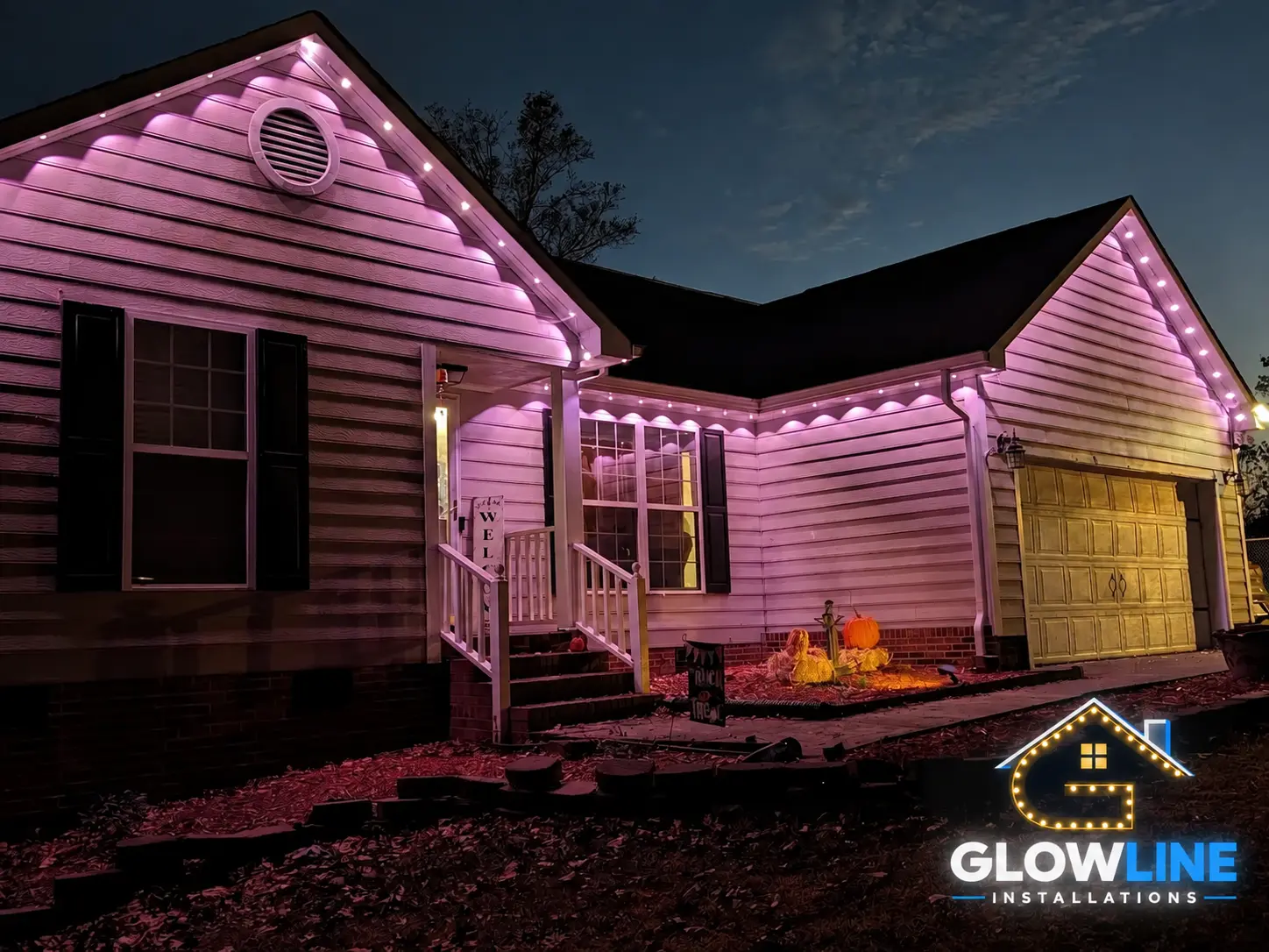 Pink permanent lights on bungalow roofline