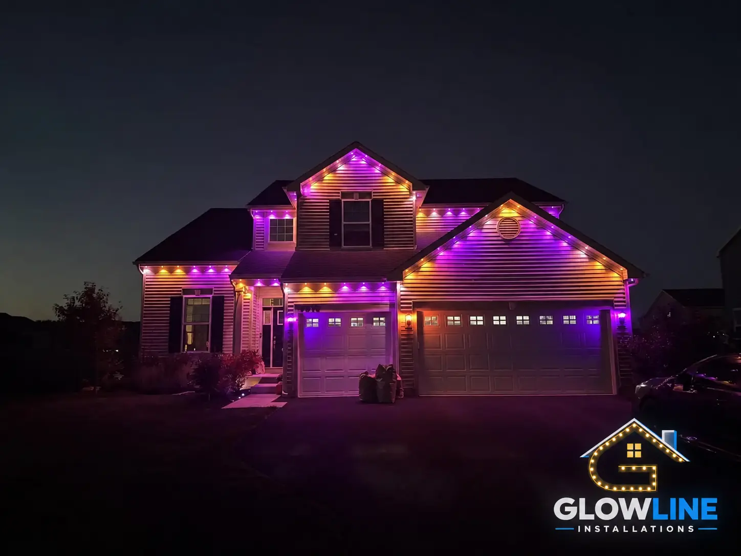 Purple outdoor lighting installation on two-storey house